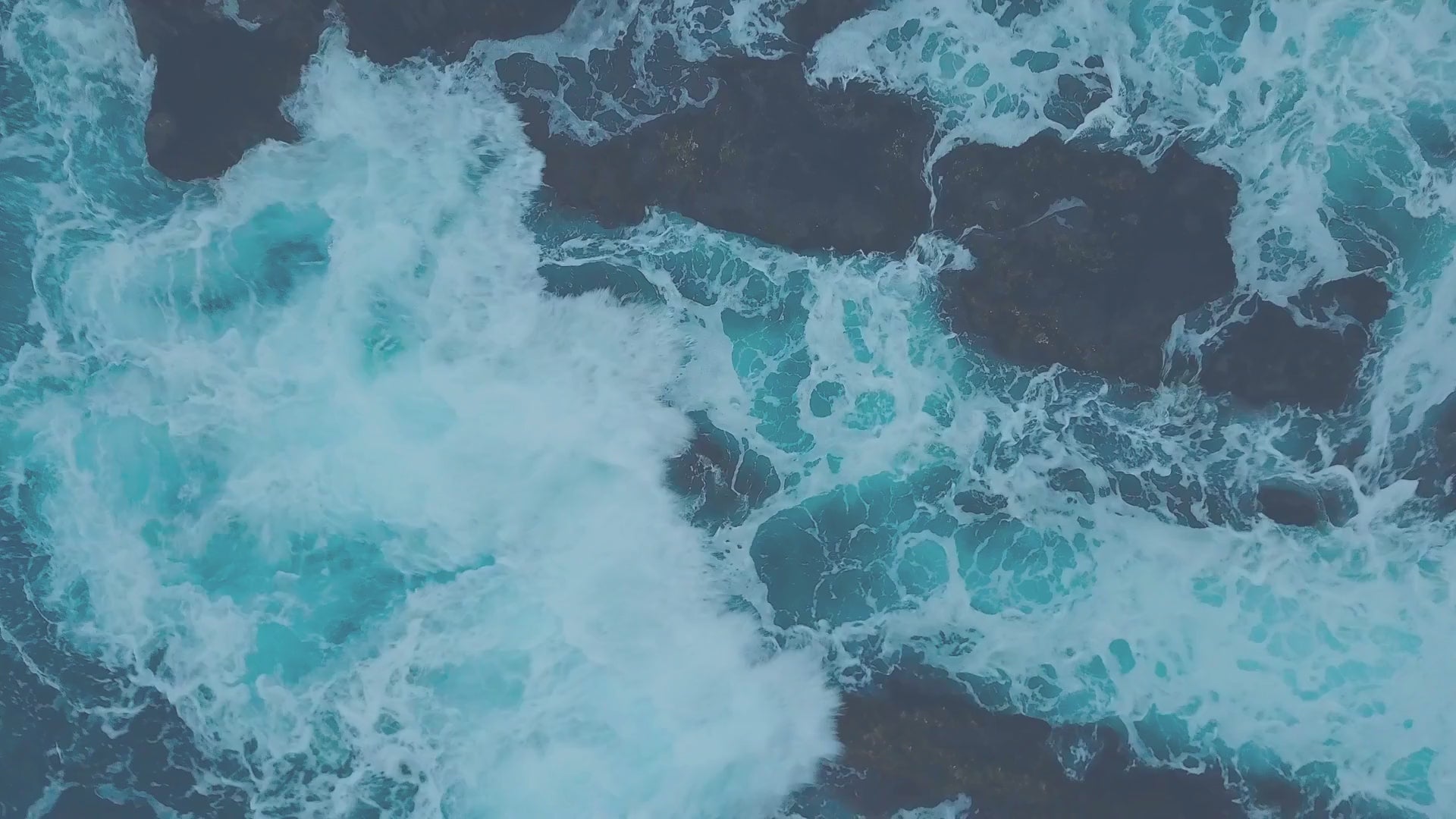 Coastal surf crashing on waves